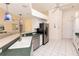 Well-equipped kitchen featuring modern stainless steel appliances and stylish pendant lighting at 3506 Saint Florent Ct, Punta Gorda, FL 33950
