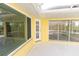 Covered lanai featuring windows and a door leading to the yard at 3506 Saint Florent Ct, Punta Gorda, FL 33950