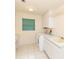 Laundry room featuring cabinets, a utility sink, and a washer and dryer at 3506 Saint Florent Ct, Punta Gorda, FL 33950