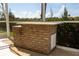 Outdoor brick kitchen and bar for entertaining with tropical landscaping at 3506 Saint Florent Ct, Punta Gorda, FL 33950