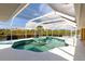 Inviting pool area features screened enclosure and serene waterfront views at 3506 Saint Florent Ct, Punta Gorda, FL 33950