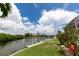 Waterfront canal view with lush landscaping and access to boating at 3506 Saint Florent Ct, Punta Gorda, FL 33950