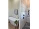 Modern bathroom featuring a soaking tub and a stand up shower with black fixtures at 3548 Mondovi Ct, Punta Gorda, FL 33950