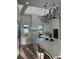 Well-lit kitchen boasting an expansive island, modern lighting, and luxury appliances at 3548 Mondovi Ct, Punta Gorda, FL 33950