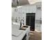 Bright kitchen featuring a large island, black stainless appliances and ample storage at 3548 Mondovi Ct, Punta Gorda, FL 33950