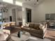 Open-concept living room with a modern kitchen, dining area, and comfortable seating arrangement at 3548 Mondovi Ct, Punta Gorda, FL 33950