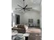 Bright, open living area with a high ceiling, modern furniture, and a view into the dining room at 3548 Mondovi Ct, Punta Gorda, FL 33950