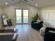Bright, airy living room with French doors, yoga mats, and stylish decor at 3548 Mondovi Ct, Punta Gorda, FL 33950