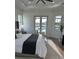 Serene main bedroom with private access to the pool area, natural light, and neutral tones at 3548 Mondovi Ct, Punta Gorda, FL 33950