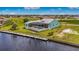 Aerial shot of a home with a pool and dock, showcasing waterfront living and community at 3548 Mondovi Ct, Punta Gorda, FL 33950
