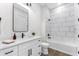 Stylish bathroom featuring a modern vanity, tub, and shower combo with sleek fixtures and contemporary design at 3548 Mondovi Ct, Punta Gorda, FL 33950