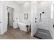 Bright bathroom showcases a modern tub, tiled shower, and sleek fixtures, creating a spa-like atmosphere at 3548 Mondovi Ct, Punta Gorda, FL 33950