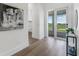 Welcoming entryway with hardwood floors, modern decor, and a view to the front porch at 3548 Mondovi Ct, Punta Gorda, FL 33950