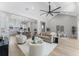 Open-concept living area with high ceilings, ample seating, and hardwood floors at 3548 Mondovi Ct, Punta Gorda, FL 33950