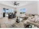 Spacious living room with plenty of natural light, comfortable seating, and views of the pool and outdoors at 3548 Mondovi Ct, Punta Gorda, FL 33950