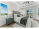 Serene bedroom with a view of the water, a king-size bed, and soft neutral tones at 3548 Mondovi Ct, Punta Gorda, FL 33950