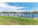 Peaceful waterfront backyard view featuring a grassy lawn and canal access for boating at 3800 Bal Harbor Blvd # 414, Punta Gorda, FL 33950
