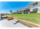 Canal front backyard with boat dock, green lawn, and outdoor seating area at 3800 Bal Harbor Blvd # 414, Punta Gorda, FL 33950