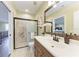 Bathroom featuring granite counters, tiled shower, and updated fixtures at 3800 Bal Harbor Blvd # 414, Punta Gorda, FL 33950
