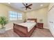 Cozy bedroom features a ceiling fan, wood floors and natural light from the window at 3800 Bal Harbor Blvd # 414, Punta Gorda, FL 33950