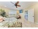 Bedroom with a ceiling fan and tile flooring, and a view of the outdoors at 3800 Bal Harbor Blvd # 414, Punta Gorda, FL 33950