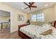 Inviting bedroom featuring wood floors, a ceiling fan, and natural light from the window at 3800 Bal Harbor Blvd # 414, Punta Gorda, FL 33950