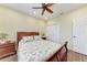 Comfortable bedroom boasts wood floors, a ceiling fan and neutral decor at 3800 Bal Harbor Blvd # 414, Punta Gorda, FL 33950