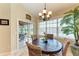 Bright breakfast nook features a round table with water views through the sliding doors at 3800 Bal Harbor Blvd # 414, Punta Gorda, FL 33950