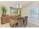 Dining room featuring wicker chairs, modern art and an abundance of light at 3800 Bal Harbor Blvd # 414, Punta Gorda, FL 33950
