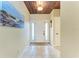 Inviting foyer with tile flooring, high ceiling and a decorative light fixture at 3800 Bal Harbor Blvd # 414, Punta Gorda, FL 33950