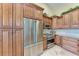 Elegant kitchen features stainless steel appliances and custom wood cabinets at 3800 Bal Harbor Blvd # 414, Punta Gorda, FL 33950