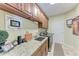 Functional laundry room with granite counters and lots of cabinet space at 3800 Bal Harbor Blvd # 414, Punta Gorda, FL 33950