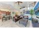 Spacious living area features a staircase, comfortable seating, and an open floor plan at 3800 Bal Harbor Blvd # 414, Punta Gorda, FL 33950
