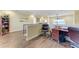 Spacious loft area featuring wood floors, railing and a desk with comfortable seating at 3800 Bal Harbor Blvd # 414, Punta Gorda, FL 33950