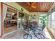 Comfortable screened lanai features a wood ceiling and views of the canal at 3800 Bal Harbor Blvd # 414, Punta Gorda, FL 33950