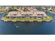 Scenic waterfront view of townhouse with private dock and a person kayaking nearby at 3800 Bal Harbor Blvd # 414, Punta Gorda, FL 33950