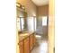 Bathroom featuring a granite-topped vanity, toilet, and glass-enclosed shower at 4150 Enclave Pl, Punta Gorda, FL 33980