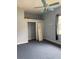 Blue bedroom with carpet, a ceiling fan, and a closet with sliding doors at 4150 Enclave Pl, Punta Gorda, FL 33980
