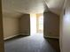 Attic bonus room featuring carpet and a large window at 4150 Enclave Pl, Punta Gorda, FL 33980