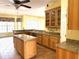 Well-appointed kitchen featuring custom cabinets, granite countertops and tile floors at 4150 Enclave Pl, Punta Gorda, FL 33980