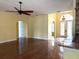 Open-concept living room featuring hardwood floors, arched doorways, and natural light at 4150 Enclave Pl, Punta Gorda, FL 33980