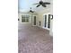 Covered brick patio with ceiling fans and access doors at 4150 Enclave Pl, Punta Gorda, FL 33980