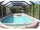 Screened pool with attached spa and ample deck space at 4150 Enclave Pl, Punta Gorda, FL 33980