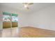 Spacious bedroom with wood-look floors and large sliding glass doors to balcony at 4346 Rayfield Dr # 4346, Sarasota, FL 34243