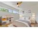 Bright bedroom featuring hardwood floors, a ceiling fan, and natural light at 4346 Rayfield Dr # 4346, Sarasota, FL 34243