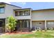 Charming home featuring a sunroom and landscaped yard at 4346 Rayfield Dr # 4346, Sarasota, FL 34243