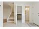 View of the light and bright foyer featuring tile flooring and staircase at 4346 Rayfield Dr # 4346, Sarasota, FL 34243