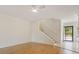 Inviting living room with hardwood flooring, a staircase, and a bright, open entryway at 4346 Rayfield Dr # 4346, Sarasota, FL 34243