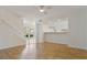 Open living area with hardwood floors seamlessly connecting to the bright kitchen space at 4346 Rayfield Dr # 4346, Sarasota, FL 34243