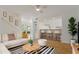 Open-concept living area with bar stool seating that connects to the kitchen area at 4346 Rayfield Dr # 4346, Sarasota, FL 34243